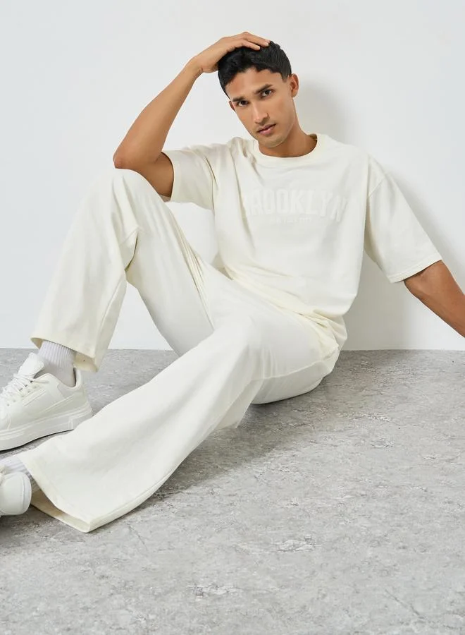 Styli  Men Cream Oversized T-Shirt and Drawstring Pants Co-Ords for Men | Best Price UAE